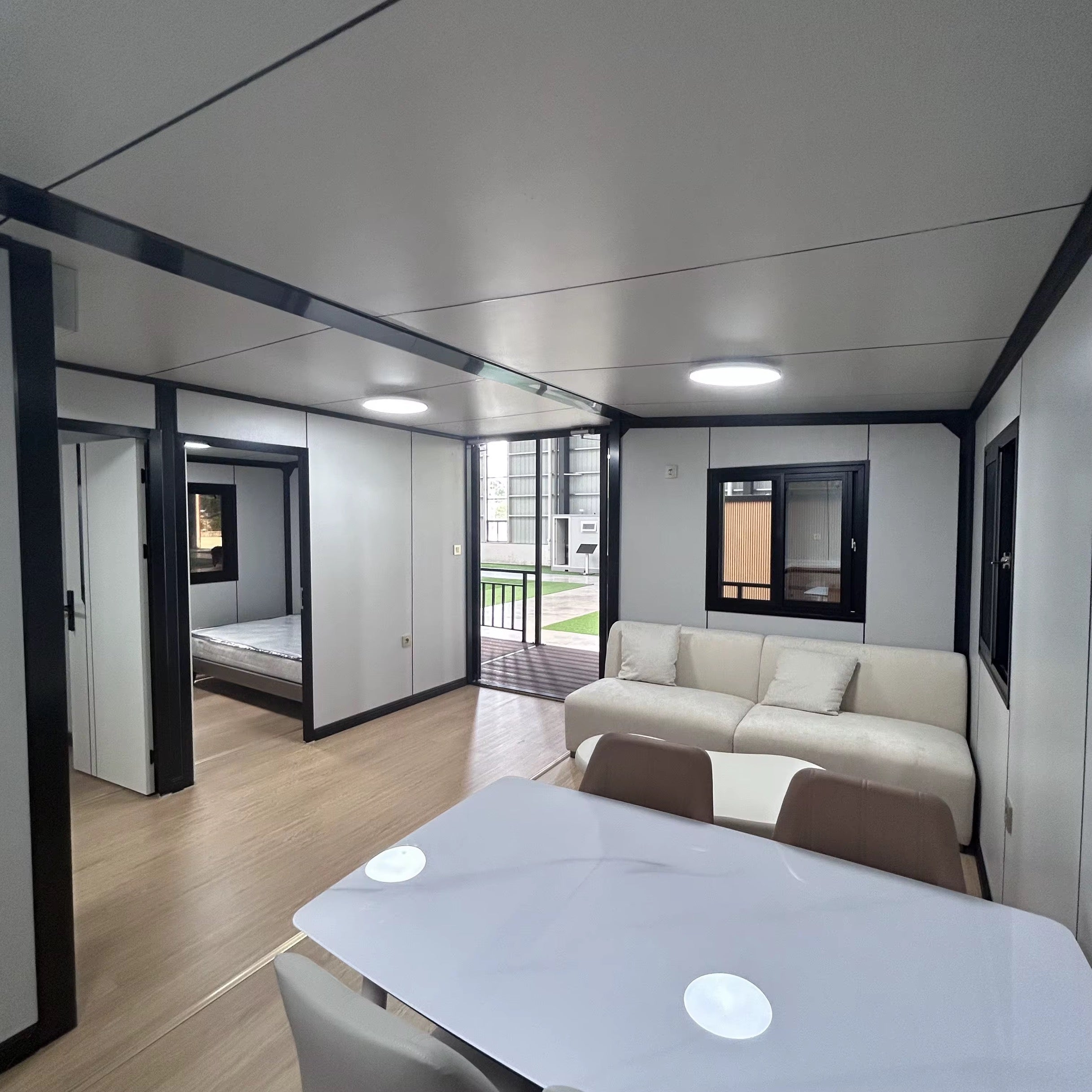 Modulinis namelis 57m² su terasa ir lenktu stogu