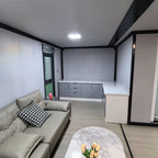 57 m² modulinis namelis su terasa ir lenktu stogu – pritaikytas žiemai