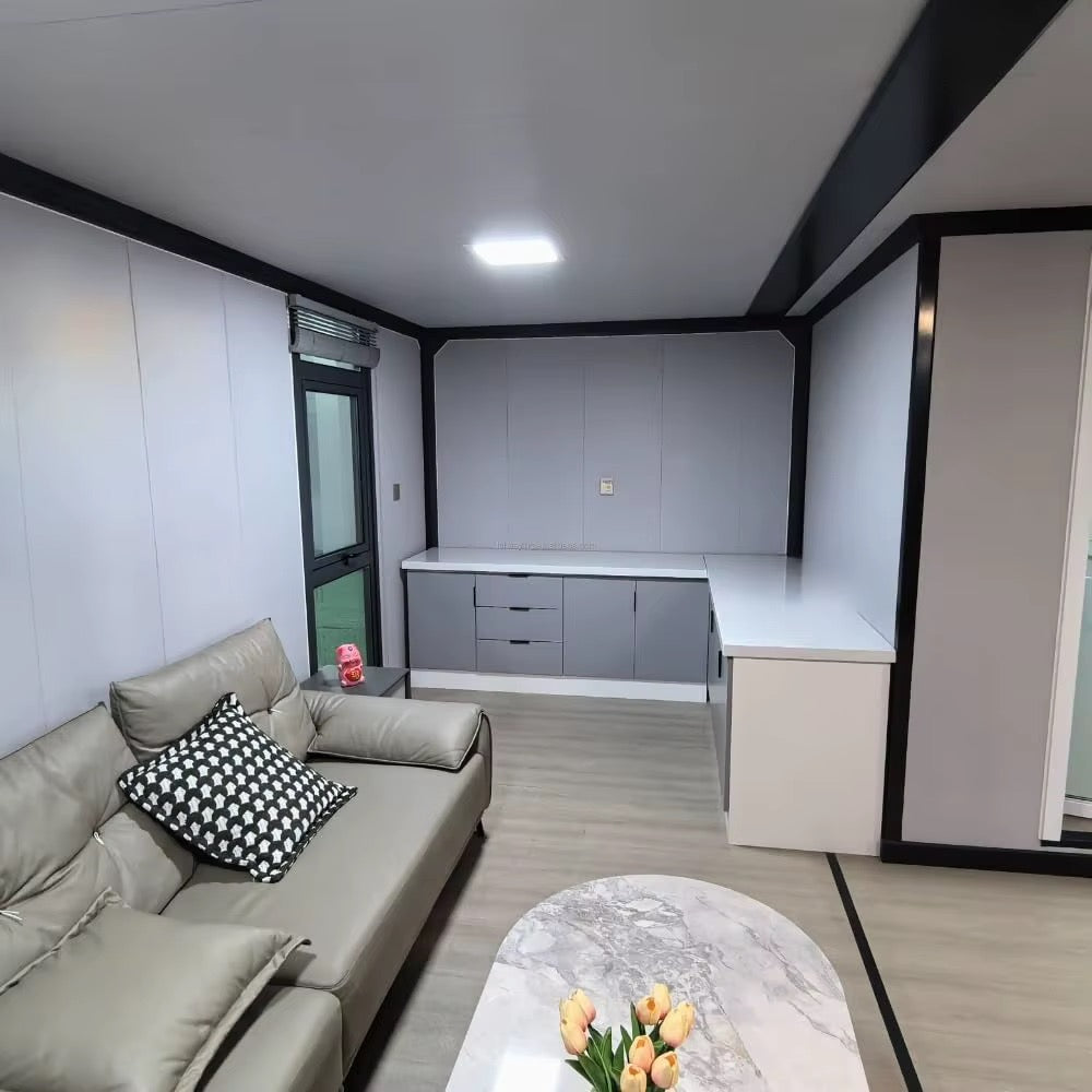 57 m² modulinis namelis su terasa ir lenktu stogu – pritaikytas žiemai